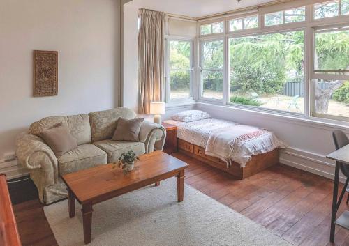 a living room with a couch and a coffee table at Art House in Melbourne
