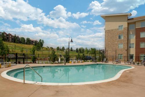 a large swimming pool in front of a building at Residence Inn by Marriott Boulder Broomfield/Interlocken in Broomfield