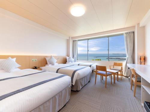Postel nebo postele na pokoji v ubytování KAMENOI HOTEL Yaizu