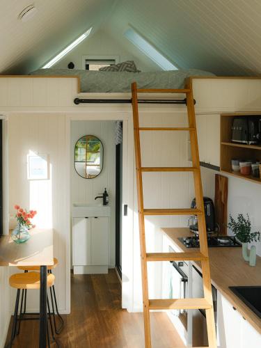 a loft bed in a tiny house at Beachside Nature Retreat on Kangaroo Island in Island Beach