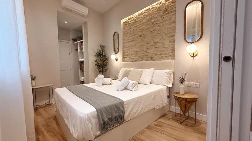 Postel nebo postele na pokoji v ubytování Aljara Suites