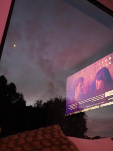 a movie poster on the side of a television screen at Coastal Nature Escape on Kangaroo Island in Pelican Lagoon