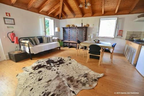 a living room with a couch and a table at Quinta dos Cochichos - Country Houses in Olhão