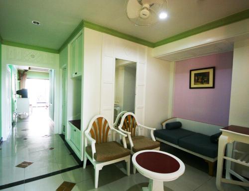 a living room with a couch and chairs at Le Ayodhaya Palace Krabi Beach Resort in Krabi town