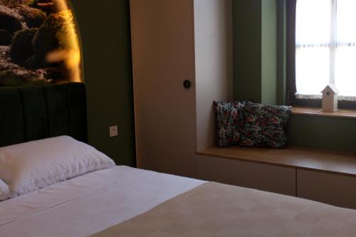 Łóżko lub łóżka w pokoju w obiekcie Portal Villa Apartments