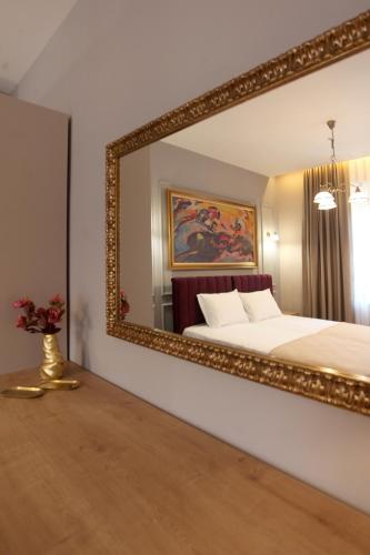 Łóżko lub łóżka w pokoju w obiekcie Portal Villa Apartments