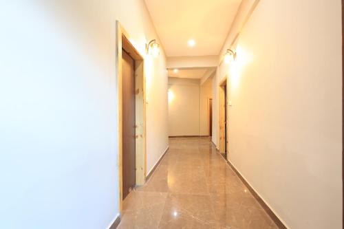 a corridor of an empty room with a hallway at Nature Roar Forest Resort ,Nainital in Nainital