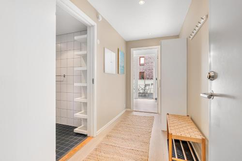 a hallway with a walk in closet and a door at 2BR Apt w Balcony by Oslo S and Munch in Oslo