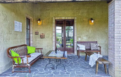 a patio with two chairs and a couch and a table at Amazing Home In Pomarance in Pomarance
