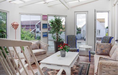 a living room with chairs and a table at Lovely Home In Höganäs With Wifi in Höganäs