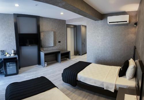 Marlen Hotel Denizliにあるベッド