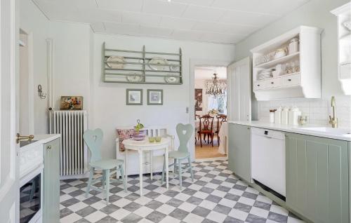a kitchen with a table and a dining room at Awesome Home In Humble With Wifi in Humble