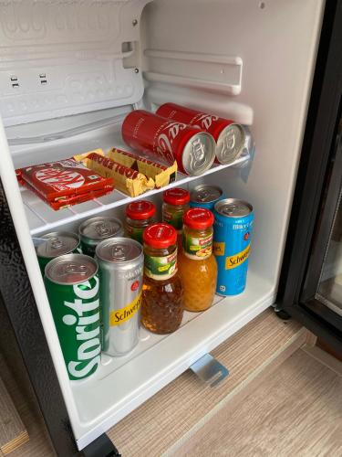 an open refrigerator filled with food and drinks at Paralian Hulhumale' in Hulhumale