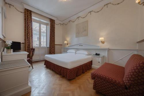 Кровать или кровати в номере Hotel Palladium Palace