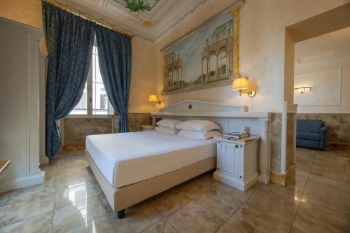 Кровать или кровати в номере Hotel Palladium Palace