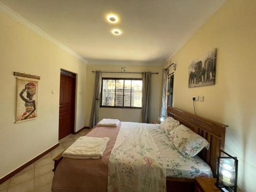 Emmalanta Homes tesisinde bir odada yatak veya yataklar