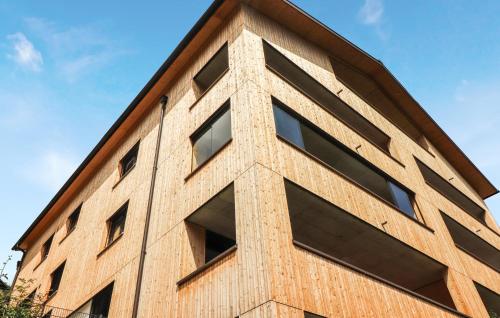 a brick building with windows on the side at Ferienwohnung Mit Terrasse in Bürserberg