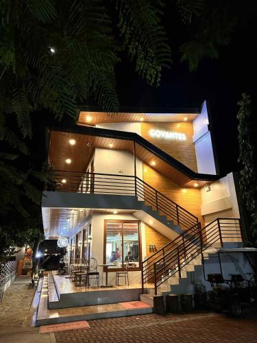 a building with a staircase in front of it at night at The Tree House - Connecting Loft Units Govantes in Vigan