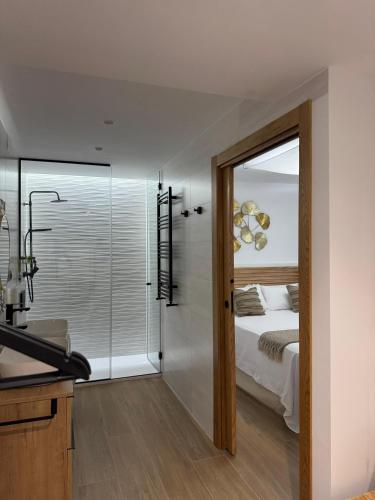 Postel nebo postele na pokoji v ubytování Casa Rural con piscina privada en casco urbano de Náquera Botigueta 25