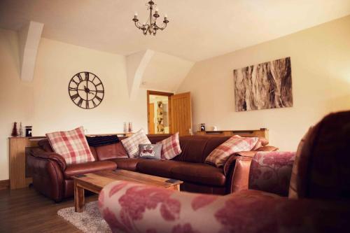 a living room with a couch and a table at Marketplace Retreat in Barnard Castle