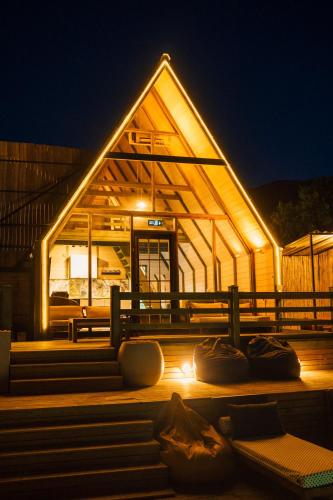 a lit up building with benches in front of it at night at tetova in Sapanca