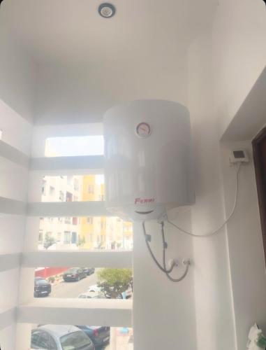 a white light in a room with a window at Appartement-suite- de standing 10 min de la plage in Agadir