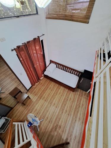 an overhead view of a room with a bed in a room at The River House - Govantes Guesthouse in Vigan