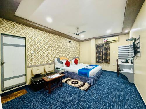 Postel nebo postele na pokoji v ubytování Grand Corporate