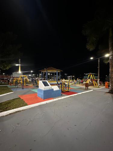 an empty park at night with a playground at Eco sítio encontro das aguas in Curuçá