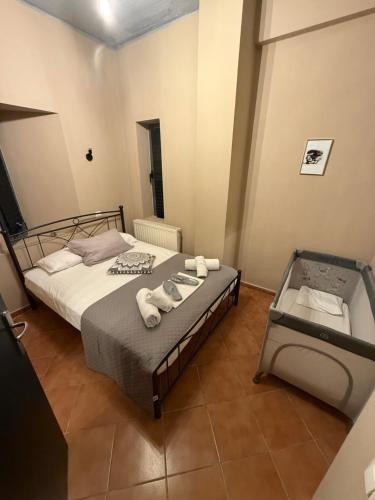 a bedroom with a bed with towels on it at Caramel Cloud in Mytilene