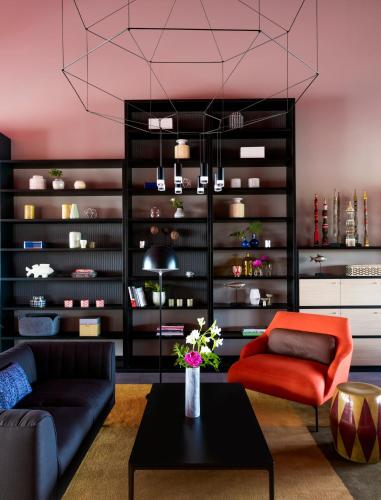 a living room with a couch and a table at OKKO Hotels Bayonne Centre in Bayonne