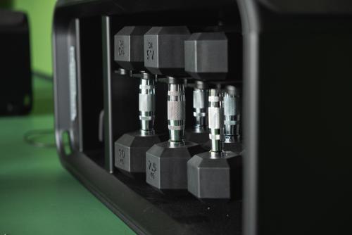 a close up of a machine with four different pipes at The Social Hub Rotterdam in Rotterdam
