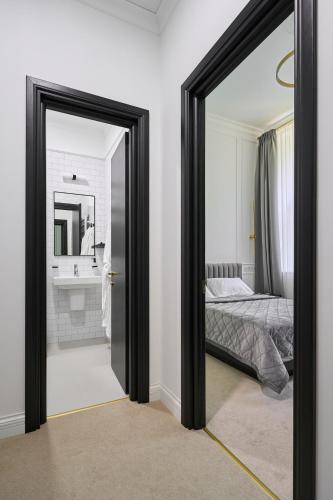 Кровать или кровати в номере Ekaterina II Hotel