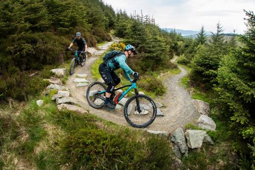 two people riding bikes on a mountain trail at Rostrevor Mountain Lodge - Glamping Pods - Revive Sauna & Hot Tubs in Rostrevor