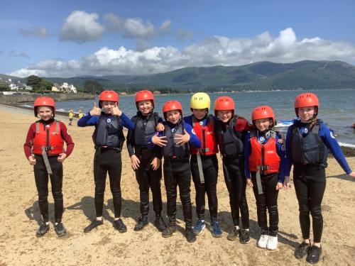 a group of people wearing helmets on the beach at Rostrevor Mountain Lodge - Glamping Pods - Revive Sauna & Hot Tubs in Rostrevor