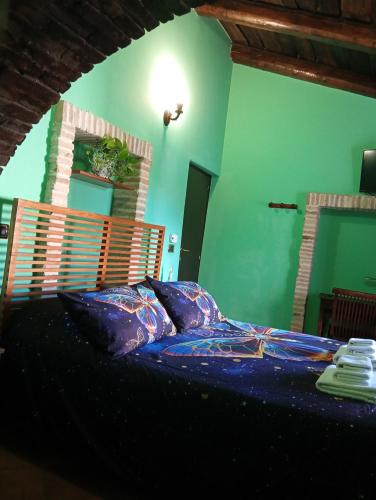 a bedroom with a bed with a wooden head board at Residenza Sant'Andrea in Campobasso