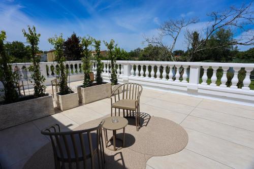 two chairs and a table on a patio at Le Renaissance in Mont-de-Marsan