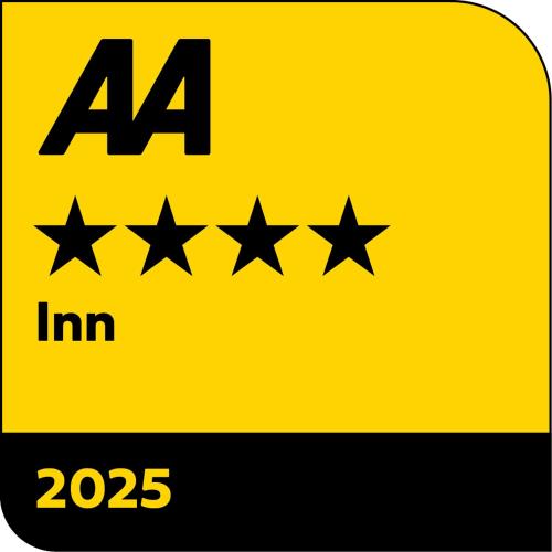 a yellow sign with four stars on it at Tally Ho! in Hatherleigh
