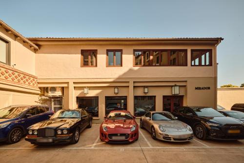 a group of cars parked in front of a building at Pamplona Catedral Hotel in Pamplona