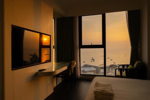 a hotel room with a view of the ocean at Sole Casa Phu Quoc in Phu Quoc