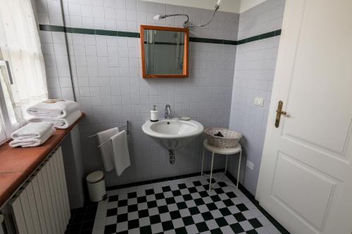 a small bathroom with a sink and a mirror at Tenuta Castello in Cerrione