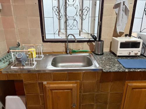 Kuchyň nebo kuchyňský kout v ubytování Chillin' Guest house