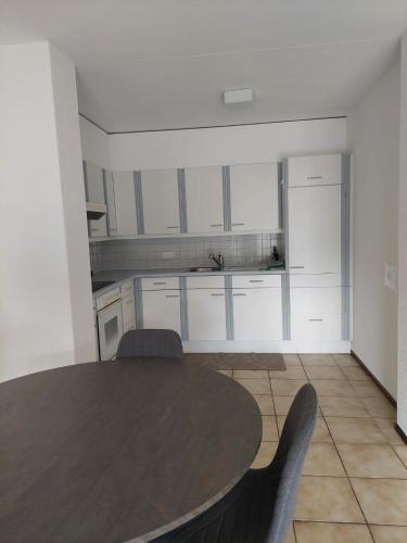 Η κουζίνα ή μικρή κουζίνα στο Caslano City Apartments