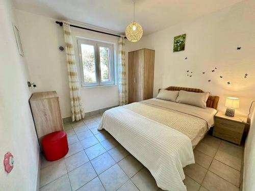 Ένα ή περισσότερα κρεβάτια σε δωμάτιο στο Ceres Apartments