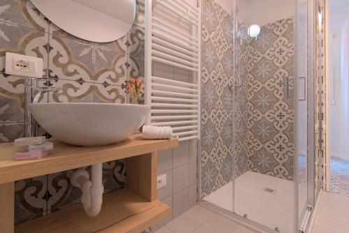 a bathroom with a sink and a shower at Lario Nest - The Suites in Mandello del Lario