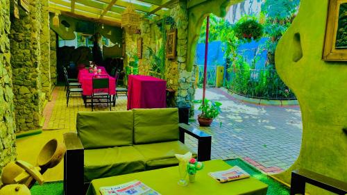 a living room with a couch and a table at parachichi house Bed and Breakfast in Arusha
