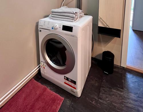 a washing machine with a towel on top of it at Artic Dream in Gratangen