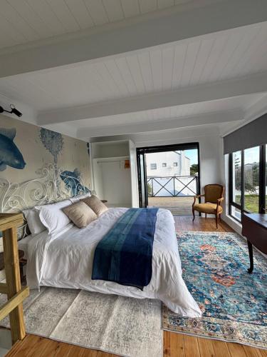 Ένα ή περισσότερα κρεβάτια σε δωμάτιο στο Blue Fish Cottage