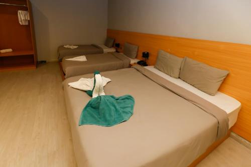 Una cama o camas en una habitación de Nut Pyramids Hotel