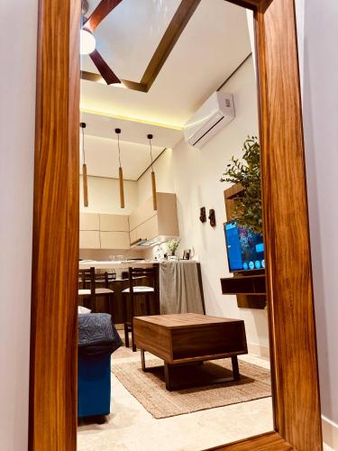 a mirror in a room with a table and a kitchen at Jungle Guardian - Rooftop Pool & Beach Club in Zona Hotelera Tulum in Tulum